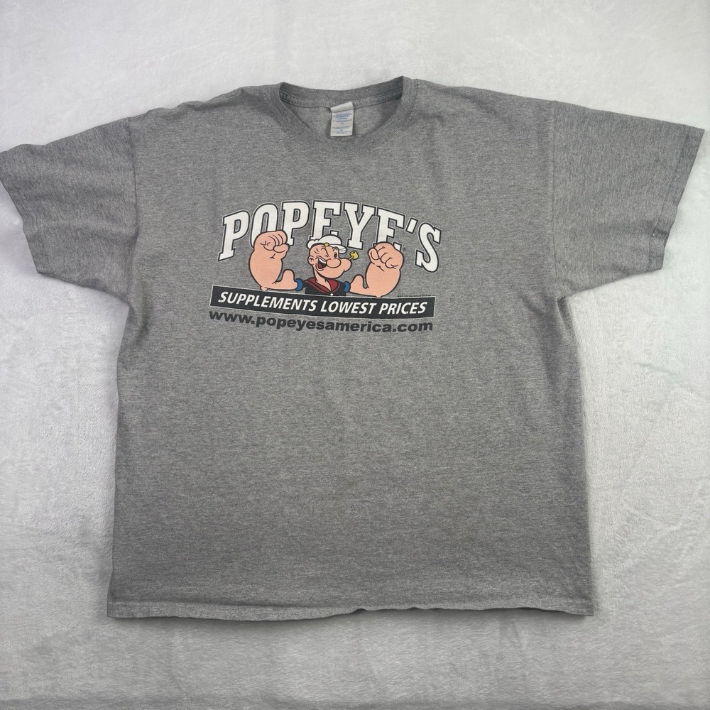 VTG 2010 M&O Knits Popeye's Supplements Grey SS Graphic Shirt Men's XL Stains